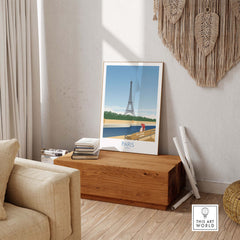 Paris Wall Art Poster Print featuring the Eiffel Tower, styled decor in a cozy living room setting.