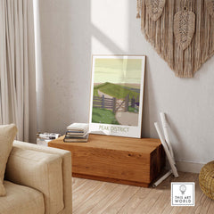 Peak District art print displayed in a stylish living room, showcasing travel-inspired vintage design.
