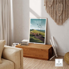 Peak District National Park poster in minimalist style displayed in a cozy living room setting.