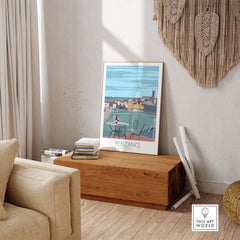 Penzance poster in a minimalist living room setting, highlighting coastal Cornwall's beauty and travel nostalgia.