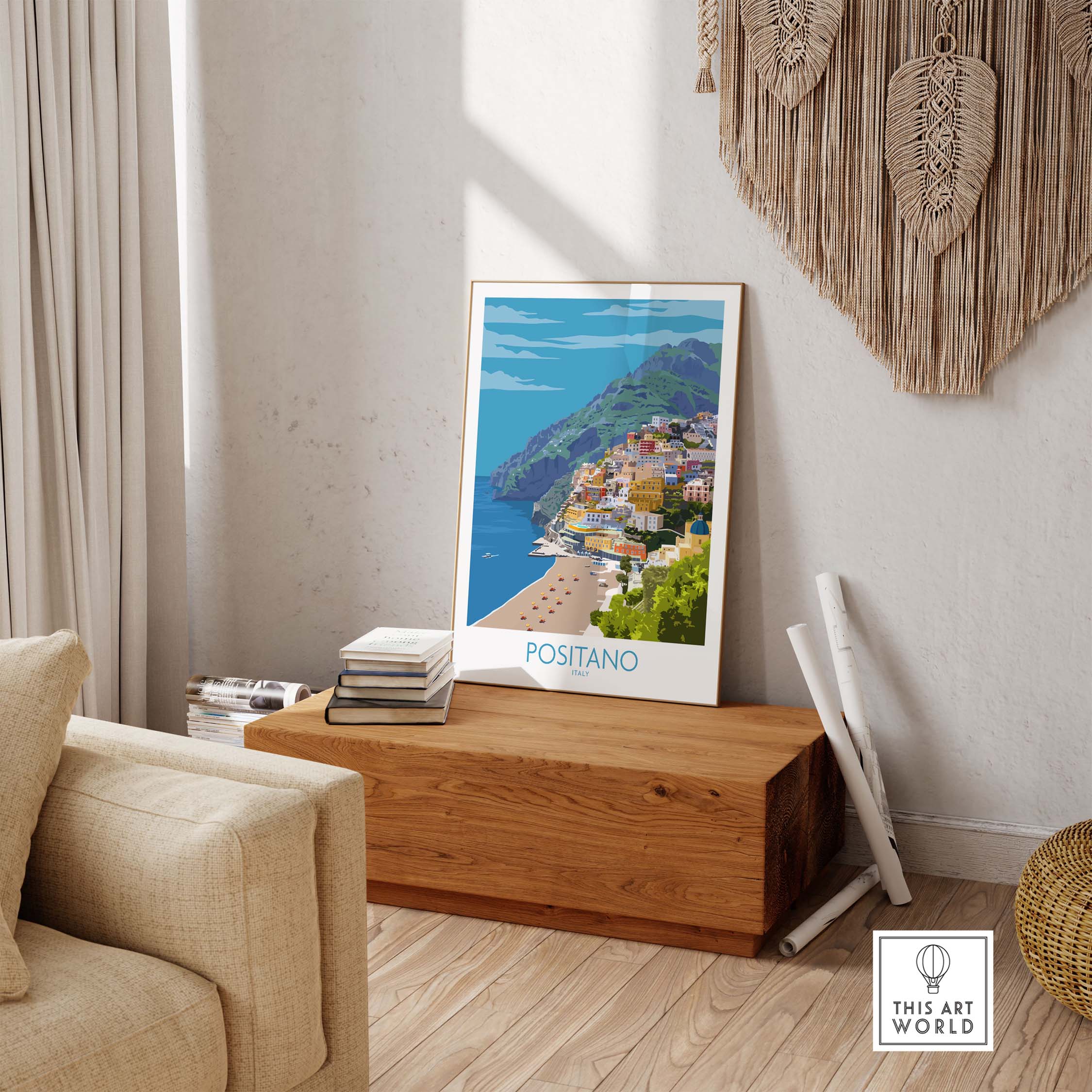 Positano Print Travel Poster displayed in a stylish living room with a cozy sofa and wooden decor.