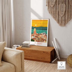 St Tropez Poster Print displayed in a stylish living room on a wooden bench, embracing vintage travel art.