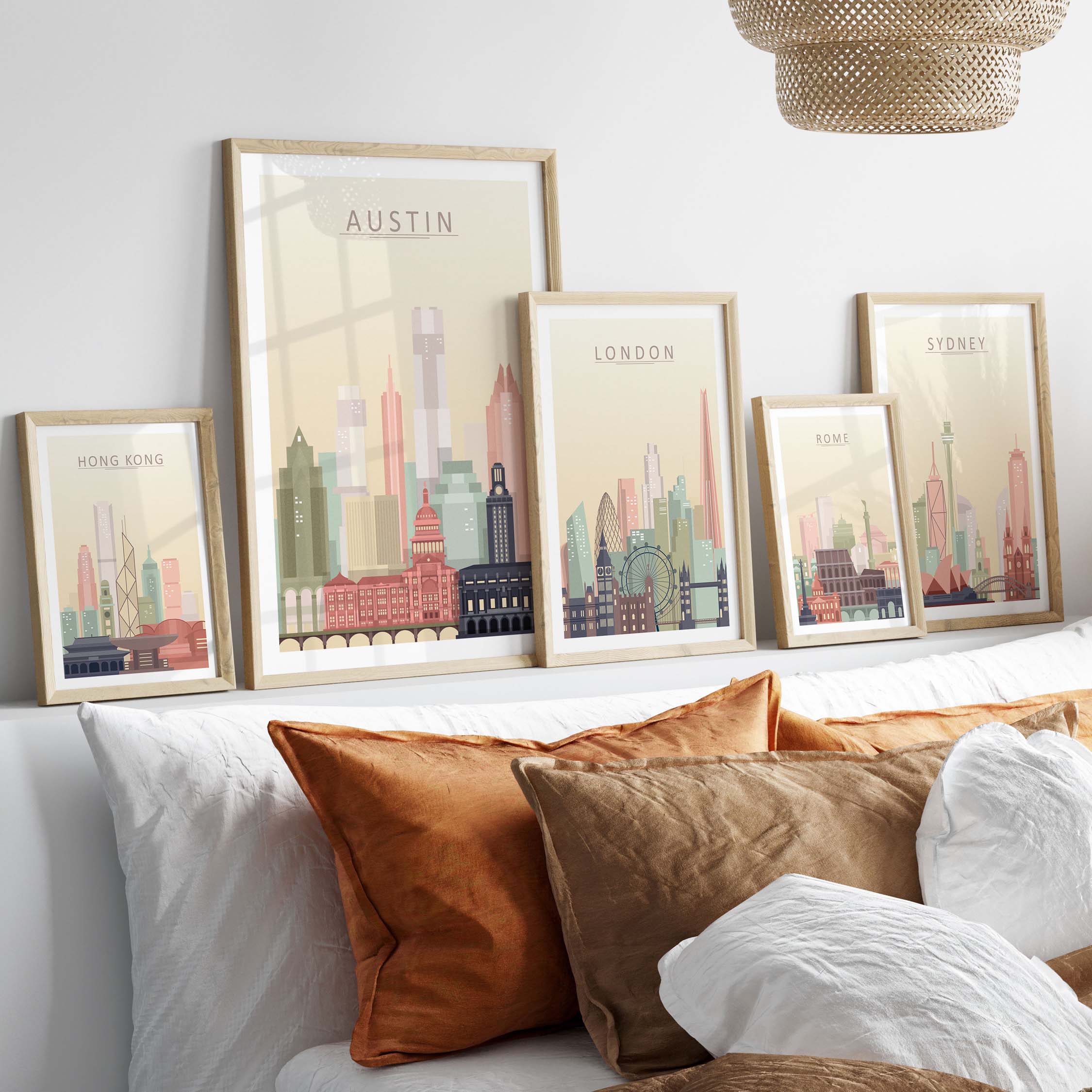 Austin Texas skyline wall art prints in warm pastel tones displayed in stylish frames on a cozy sofa.