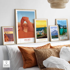 Collection of framed National Park art prints including Arches, Yellowstone, and more on a stylish wall display.
