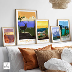 Framed vintage National Park posters including Great Smoky Mountains, Yellowstone, and Grand Canyon, displayed in a stylish living room.