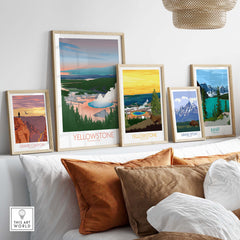 Framed art prints of Yellowstone National Park and other national parks, showcasing vibrant landscapes in a stylish home setting.