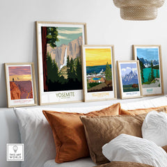Framed Yosemite Park poster print among other vintage-style national park artworks in a stylish living room setting.