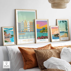 Framed Amsterdam print among vintage travel posters in a stylish living room, showcasing modern art inspiration.
