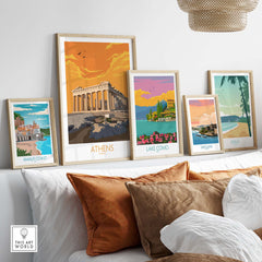 Athens poster and travel prints displayed on a shelf, showcasing vintage-style art of Greece and other destinations.