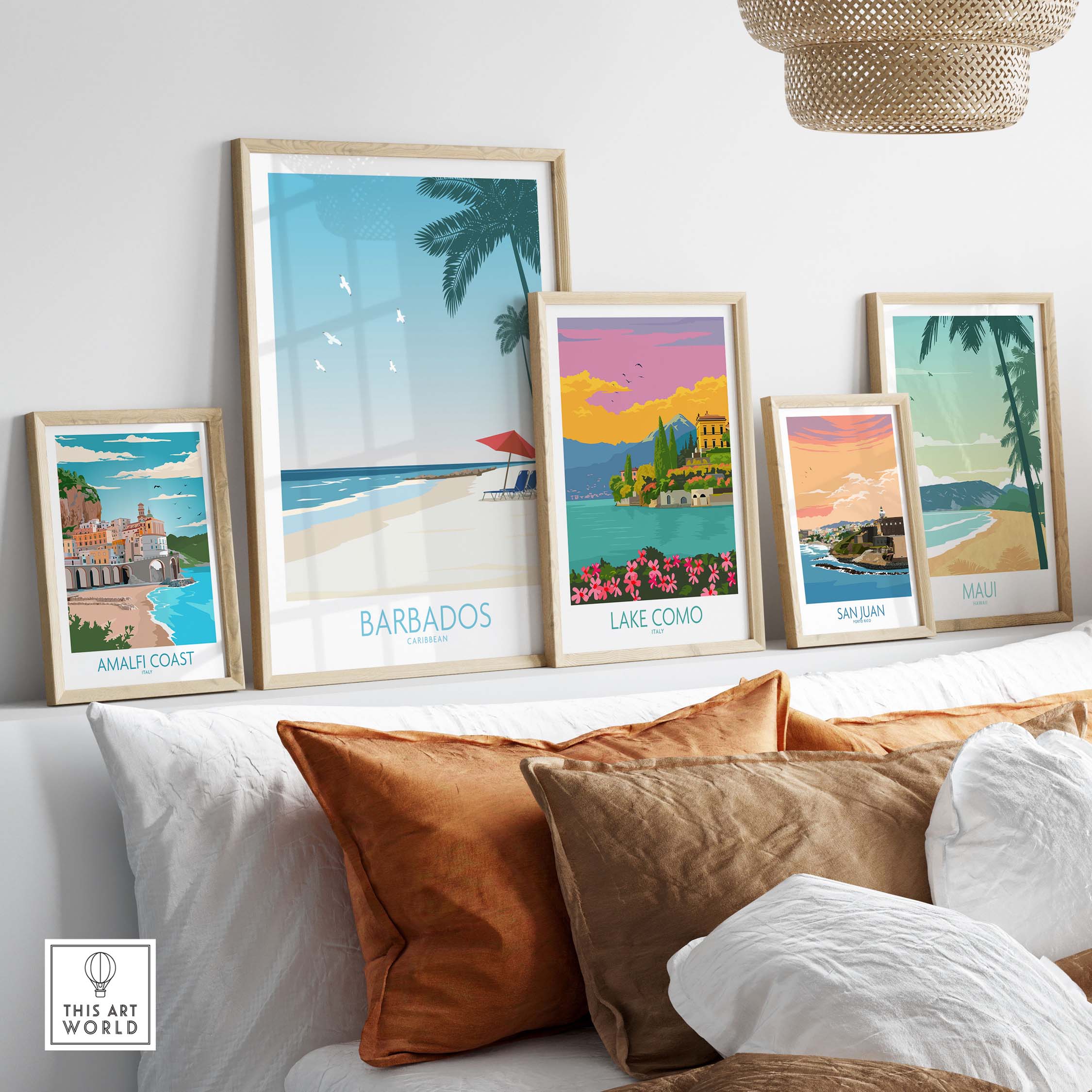 Collection of vintage travel posters including Barbados, Amalfi Coast, Lake Como, San Juan, and Maui displayed in a stylish setting.