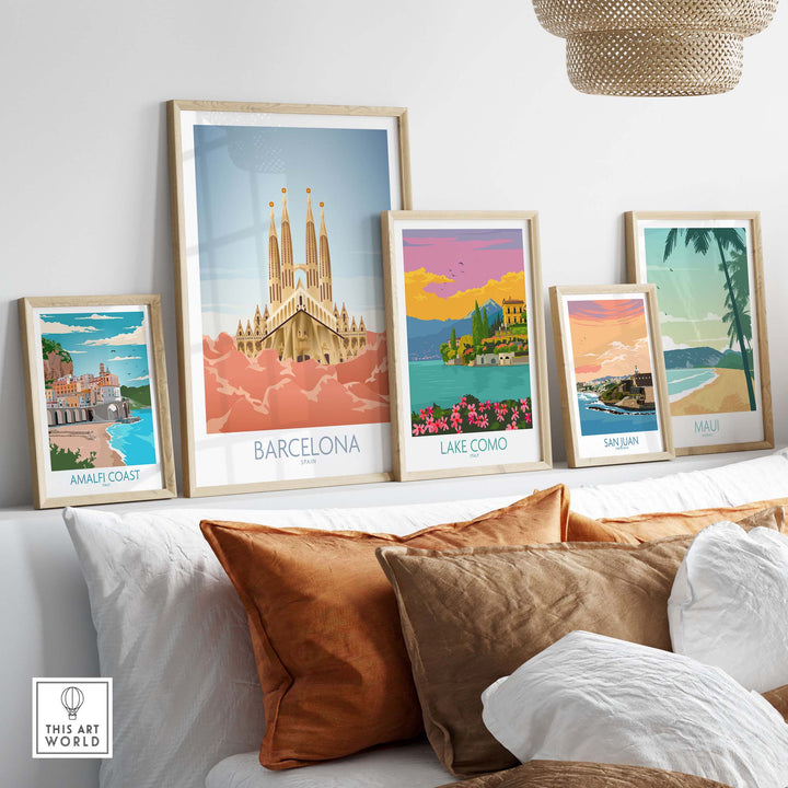 Collection of vintage travel prints including Barcelona, Lake Como, San Juan, and Amalfi Coast displayed in stylish frames.