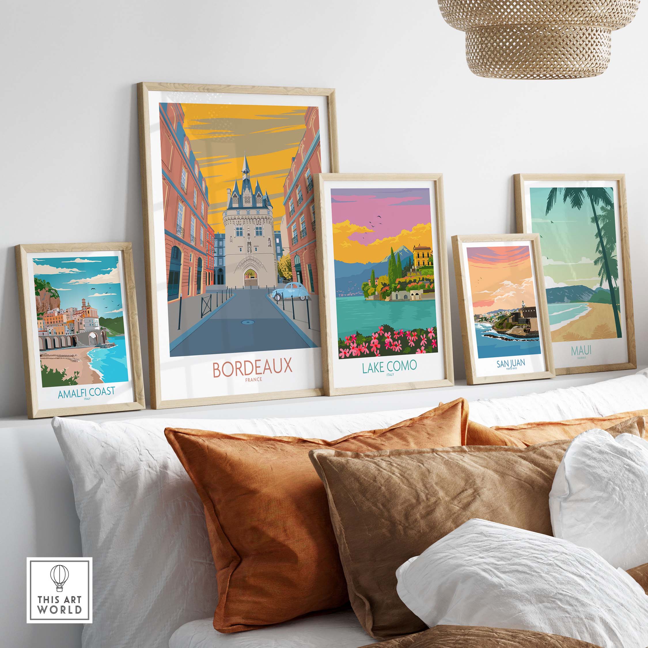 Bordeaux travel poster and vintage art prints displayed in a stylish home setting with cozy cushions.