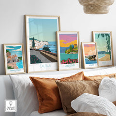 Stylish travel posters featuring Calella, Amalfi Coast, Lake Como, San Juan, and Maui decor on a modern wall.