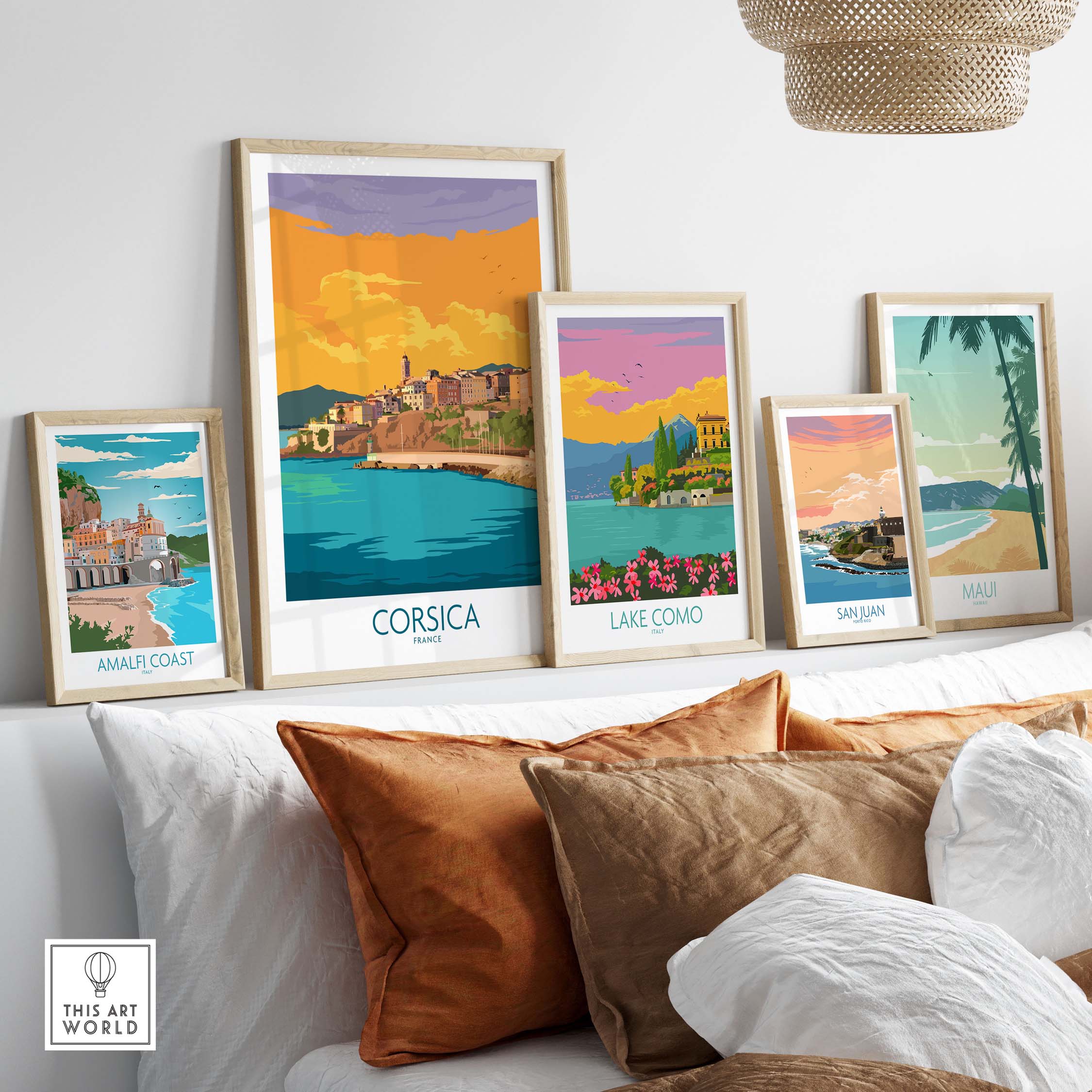 Elegant travel posters featuring Corsica, Lake Como, Amalfi Coast, San Juan, and Maui, styled against a cozy interior decor.