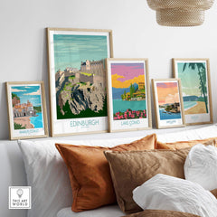 Stylish Edinburgh Print Scotland Travel Poster displayed with other travel art prints on a cozy sofa setting.