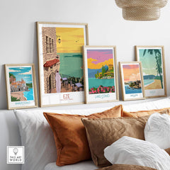 Eze Print France Travel Poster collection displayed in stylish frames on a cozy sofa setting.