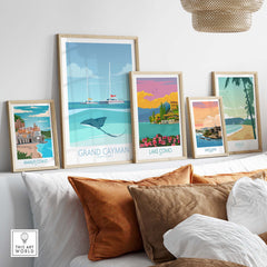Collection of vintage travel posters including Grand Cayman and Amalfi Coast art prints on a stylish interior wall.
