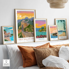 Framed Great Wall of China print with vintage travel posters on display in a stylish living room.