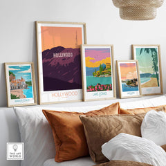 Hollywood Print California Poster displayed among vintage travel art prints on a stylish home shelf.