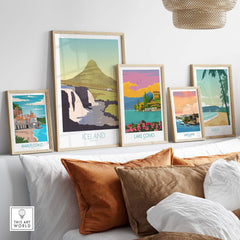 Iceland Print Travel Poster and framed prints of Lake Como, Amalfi Coast, San Juan, and Maui displayed in a stylish living room.