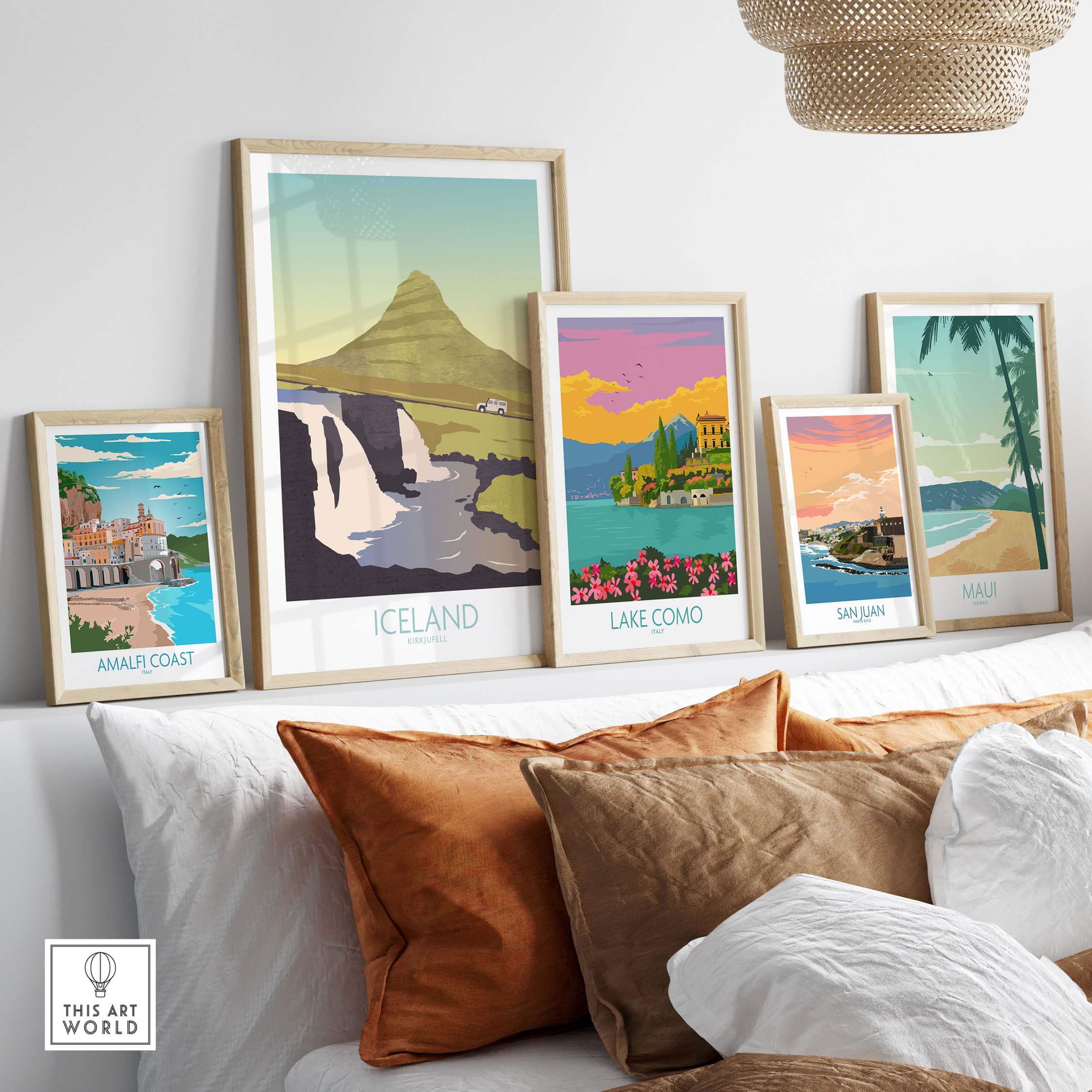 Iceland Print Travel Poster and framed prints of Lake Como, Amalfi Coast, San Juan, and Maui displayed in a stylish living room.