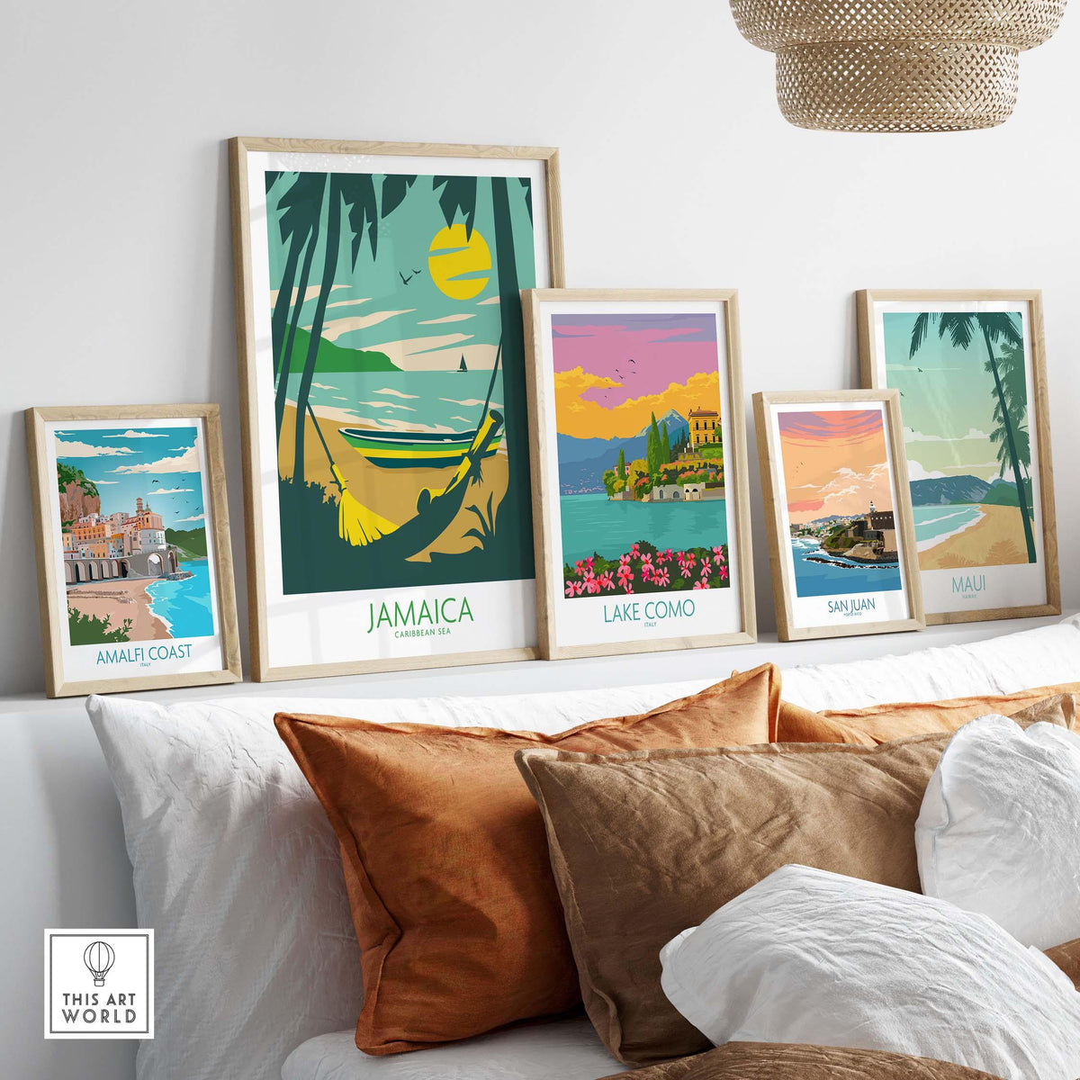 Stylish travel posters featuring Jamaica, Lake Como, San Juan, and Maui displayed on a modern sofa.