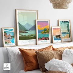 Lake District poster print and other travel art prints displayed on a decorative shelf in a modern living space.
