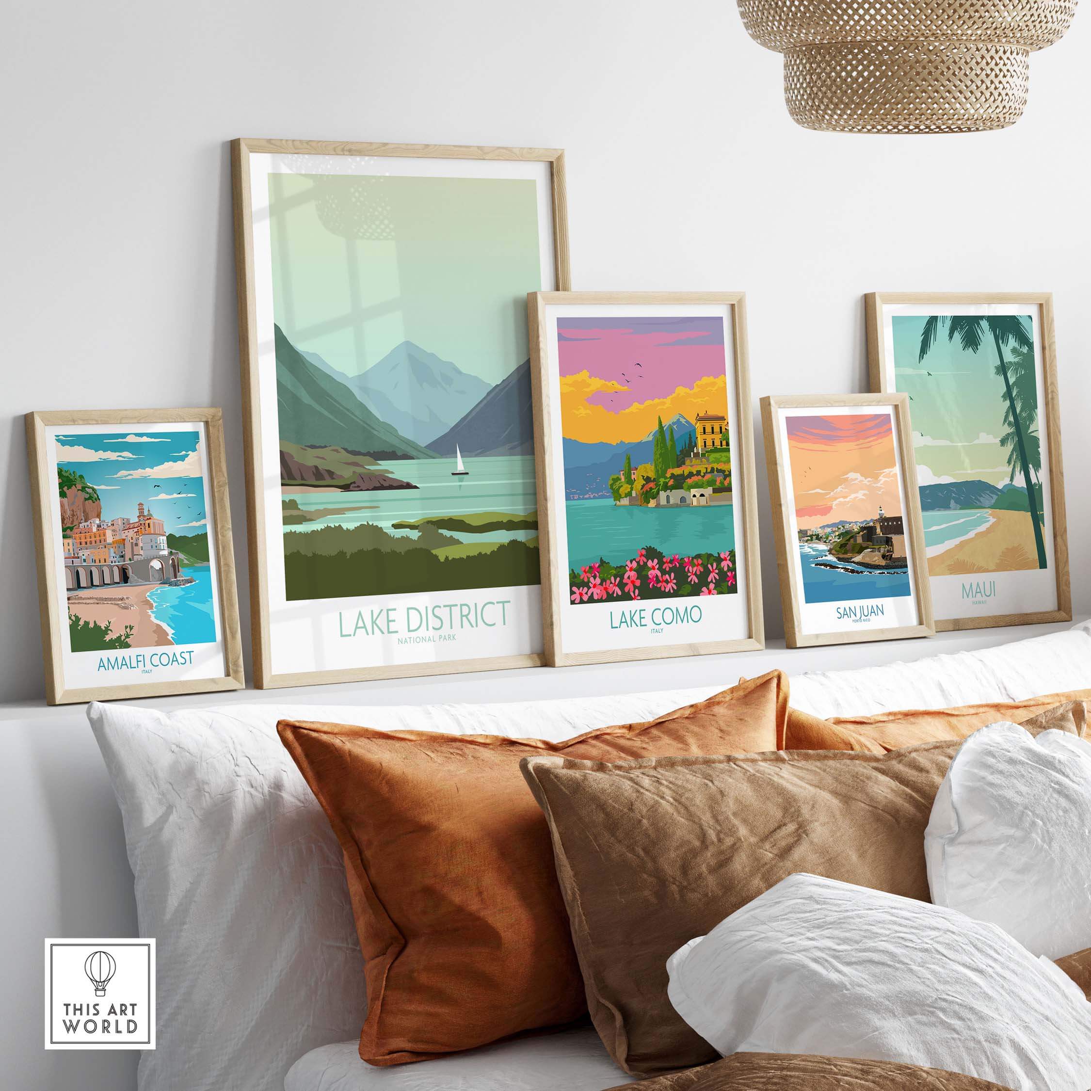 Lake District poster print and other travel art prints displayed on a decorative shelf in a modern living space.