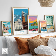 Lucca Print Italy Travel Poster collection on a stylish sofa, showcasing vintage travel art framed.