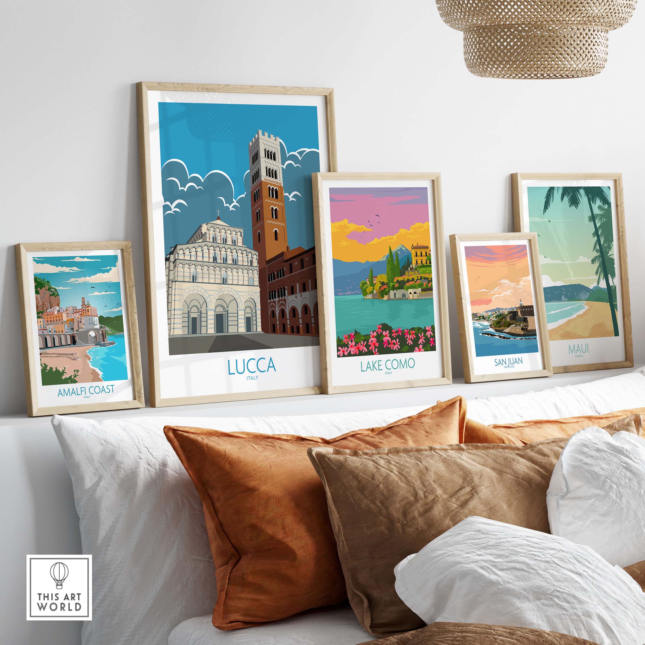Lucca Print Italy Travel Poster collection on a stylish sofa, showcasing vintage travel art framed.