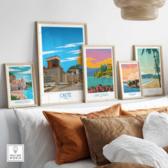 Framed Crete wall art prints showcasing vintage Greece travel posters on a stylish shelf with decorative cushions.