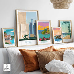 Detroit wall art print framed among other travel posters, showcasing vintage-inspired designs in a modern home setting.
