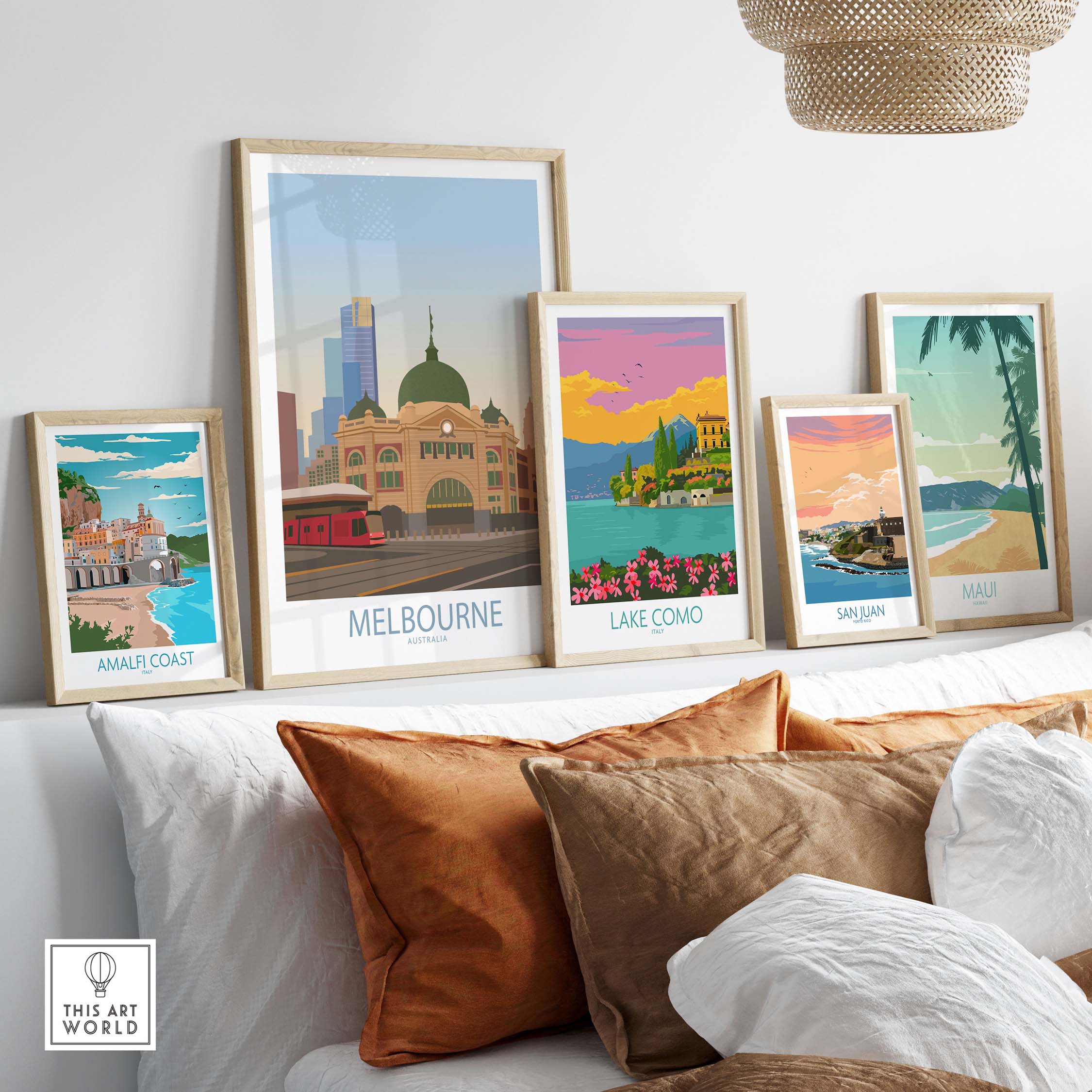 Melbourne poster art displayed on a stylish shelf, featuring vibrant travel destinations and framed prints.