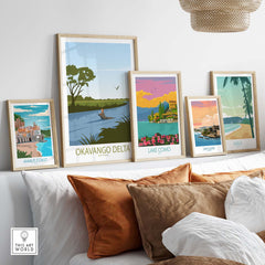 Collection of vintage travel posters featuring Okavango Delta and other destinations displayed in a stylish home setting.