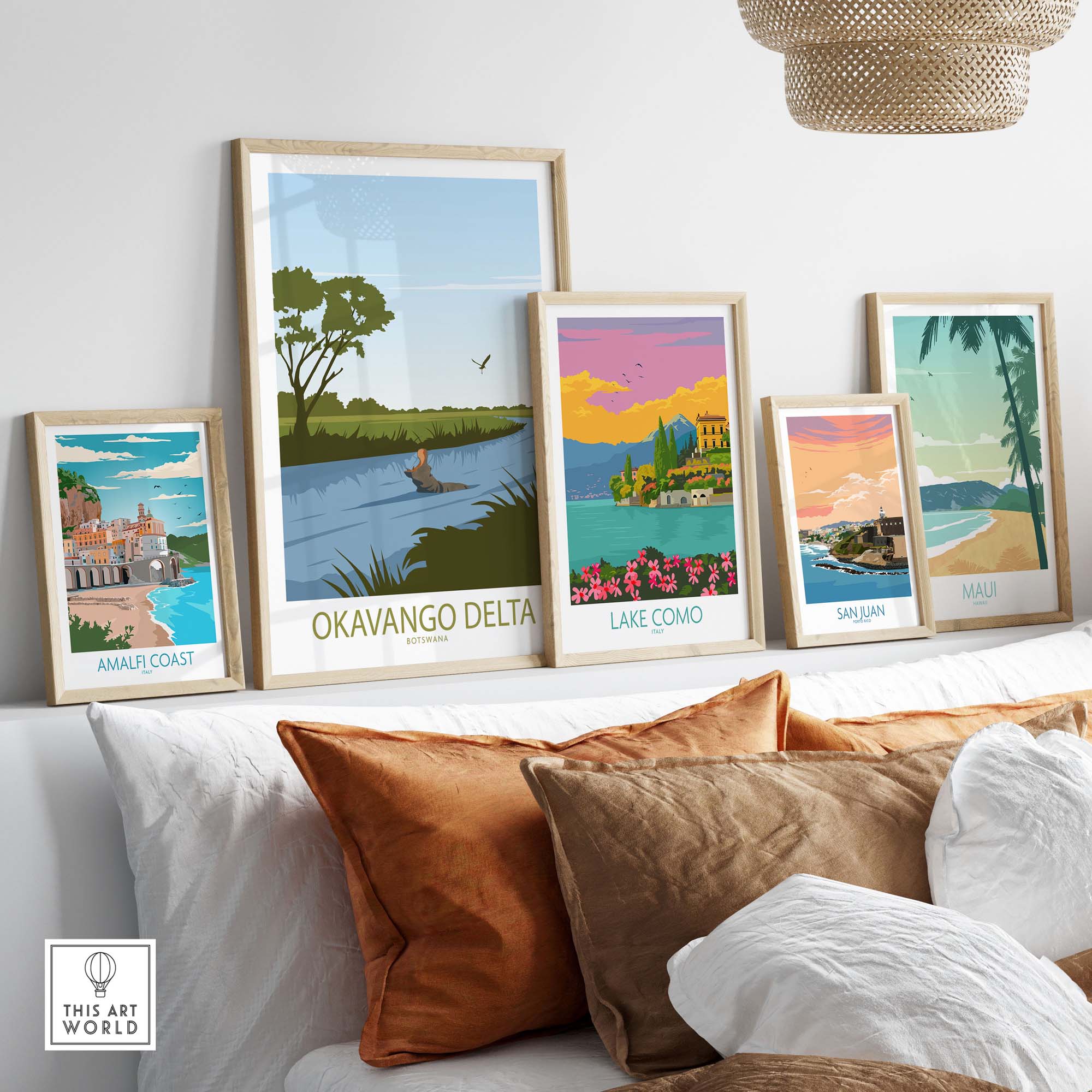 Collection of vintage travel posters featuring Okavango Delta and other destinations displayed in a stylish home setting.