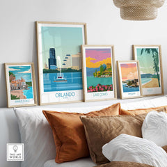 Orlando Wall Art Print collection featuring vintage-inspired travel posters displayed stylishly on a sofa.