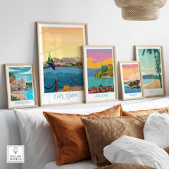 Cape Town print and vintage travel posters displayed in a stylish living space with earthy tones and modern decor.