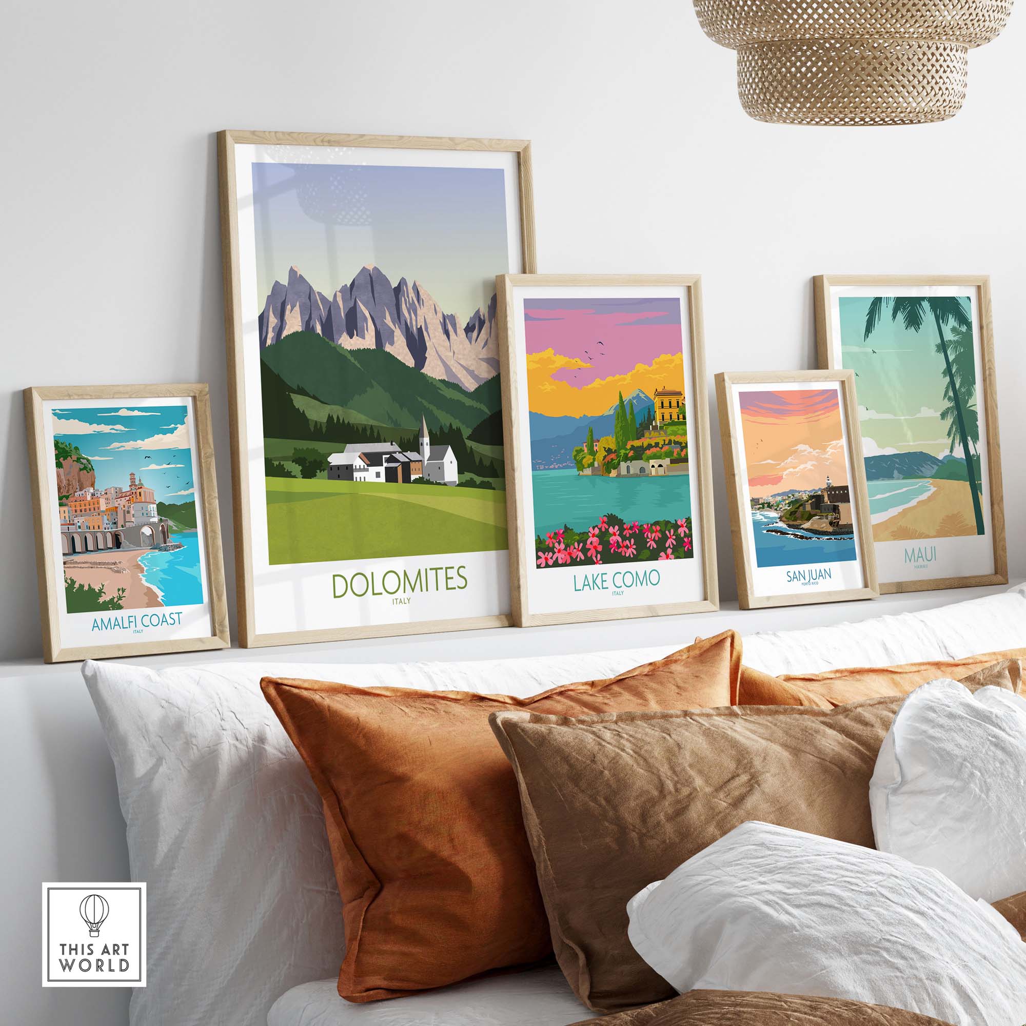 Framed Dolomites wall art print alongside other Italy travel posters on a stylish shelf.