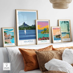 Collection of vintage travel posters including Mauritius, Amalfi Coast, Lake Como, San Juan, and Maui in a stylish living room.