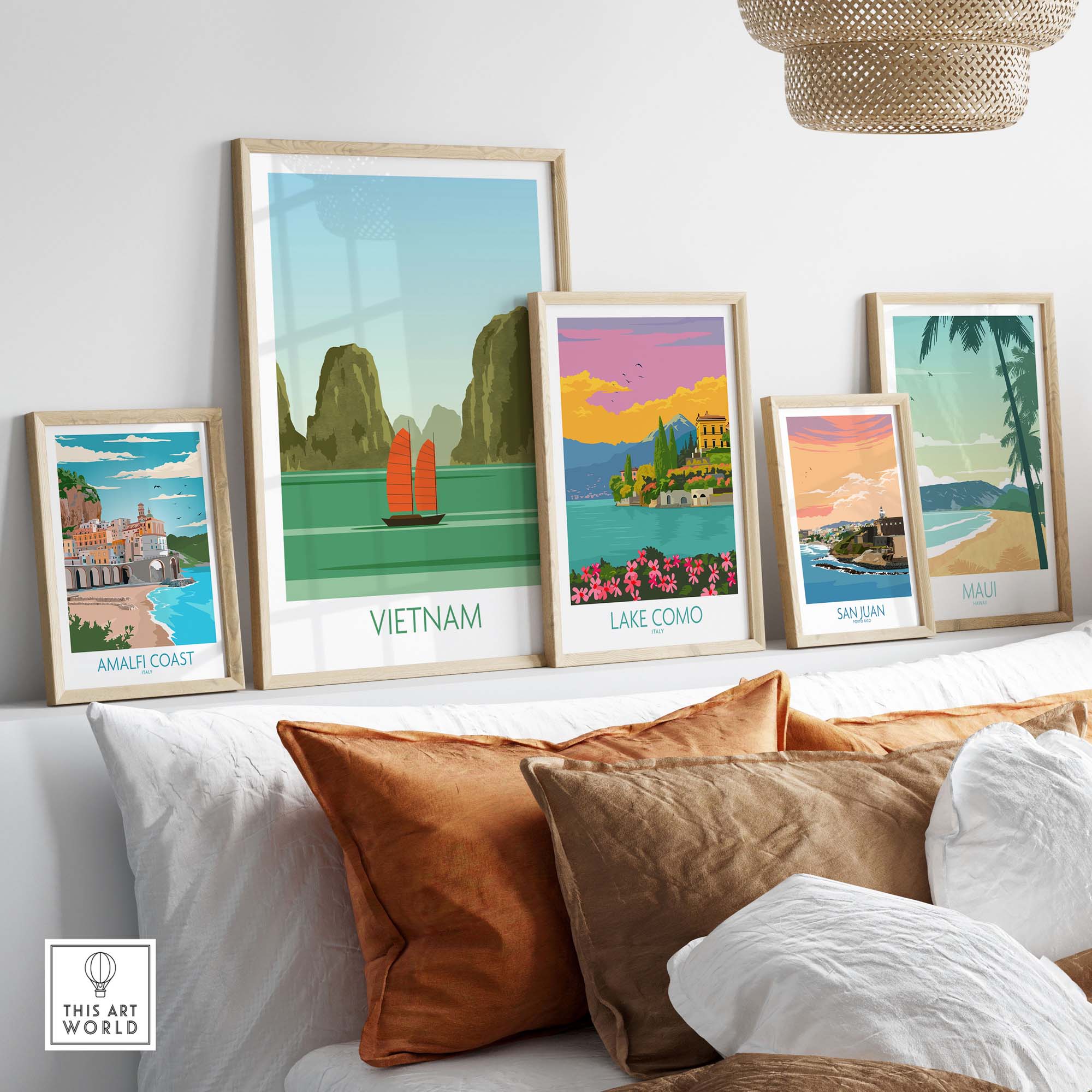Collection of vintage travel posters featuring Vietnam, Lake Como, Amalfi Coast, San Juan, and Maui art prints displayed stylishly.
