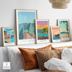 Collection of vintage travel posters including Machu Picchu, Lake Como, and Amalfi Coast in stylish frames.