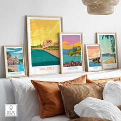 Framed Mallorca poster alongside other vintage travel art prints in a stylish living room setting.