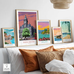 Stylish Manchester art print framed among other vintage travel posters in a modern home setting.