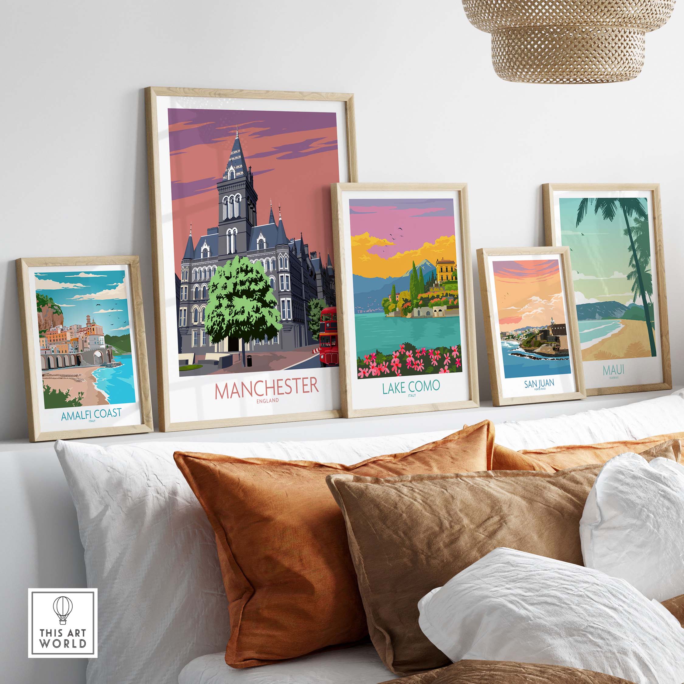 Stylish Manchester art print framed among other vintage travel posters in a modern home setting.