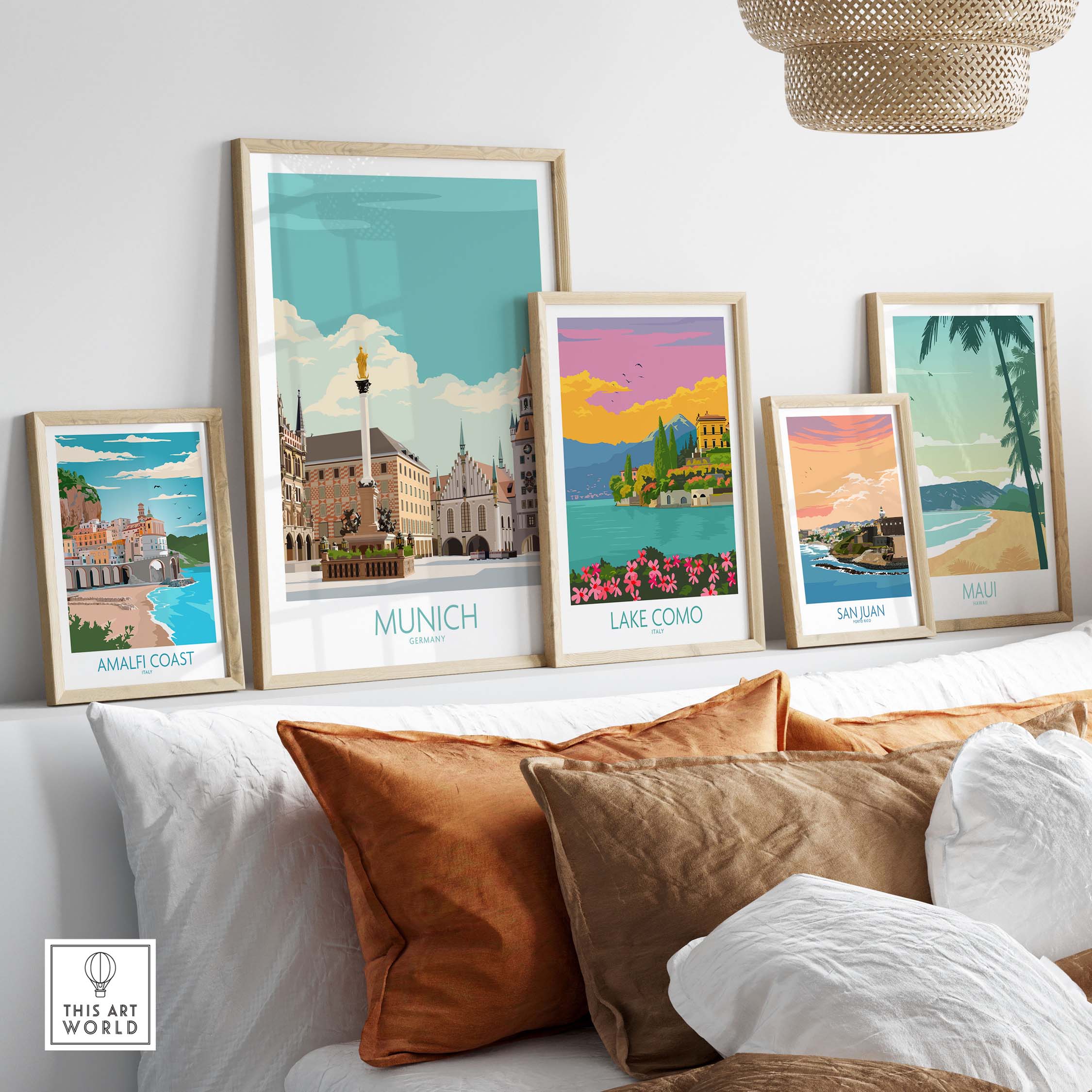 Stylish framed Munich travel poster among vintage travel art prints on a cozy living room wall.