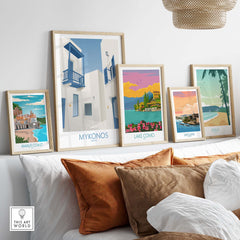 Mykonos wall art print and travel posters displayed stylishly on a couch in a cozy living room.