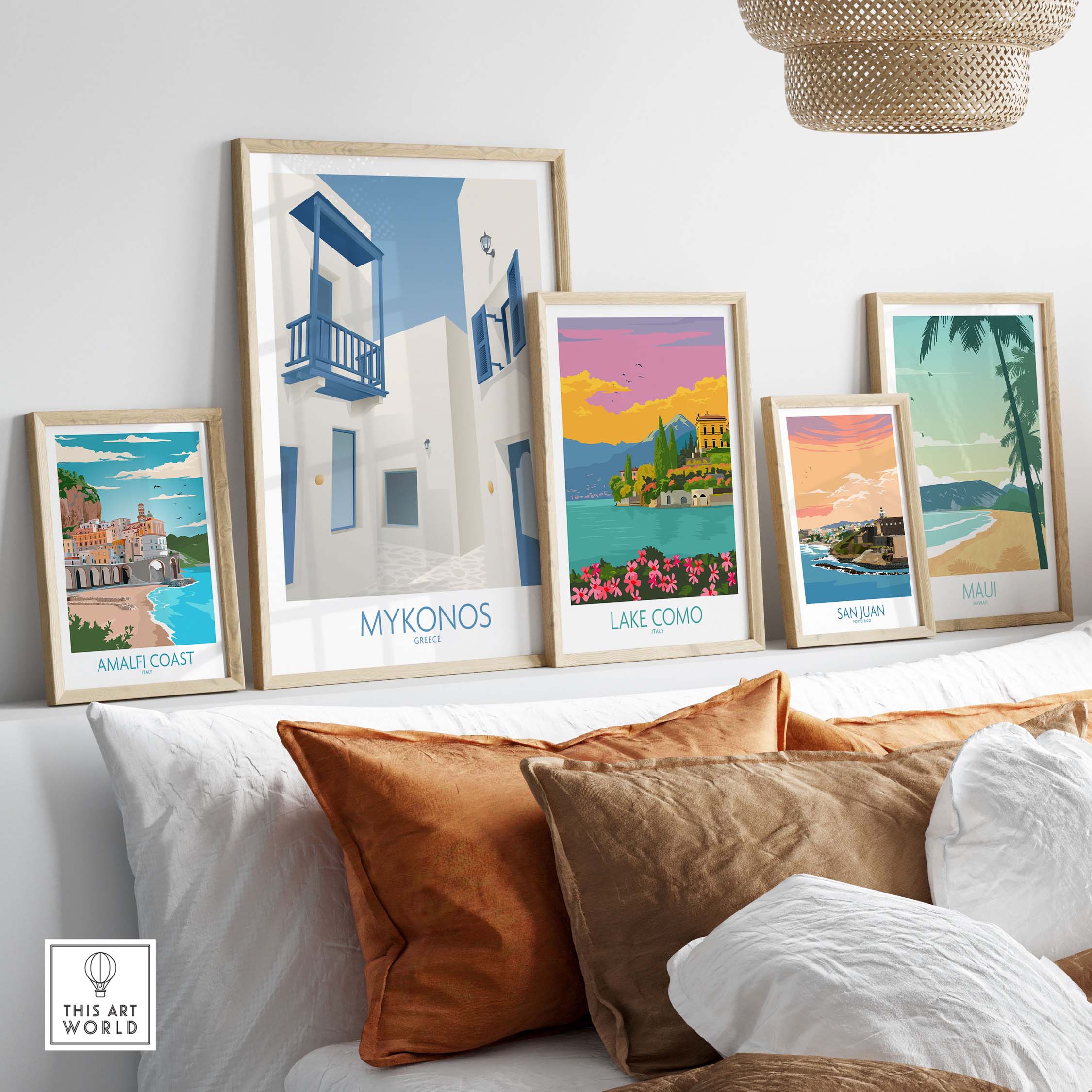 Mykonos wall art print and travel posters displayed stylishly on a couch in a cozy living room.