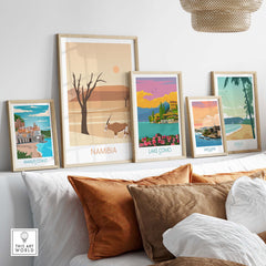 Namibia travel poster print displayed among vintage-style wall art in a stylish home setting.