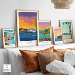 Framed Oslo poster surrounded by travel art prints of Amalfi Coast, Lake Como, San Juan, and Maui on a stylish shelf.