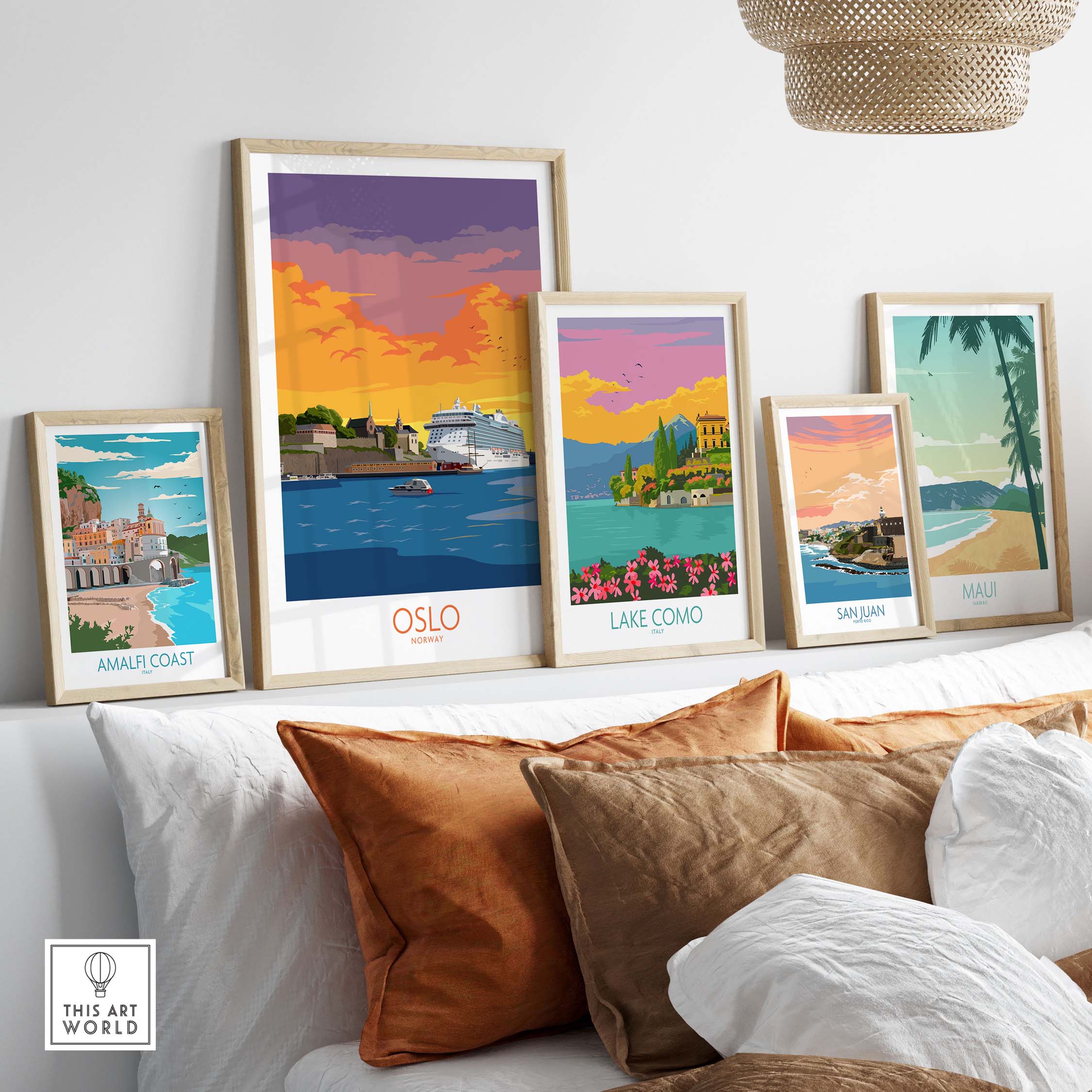 Framed Oslo poster surrounded by travel art prints of Amalfi Coast, Lake Como, San Juan, and Maui on a stylish shelf.